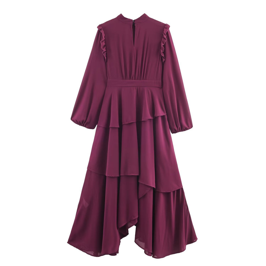 Back view of a burgundy tiered asymmetric dress with a keyhole neck opening and gathered waist.