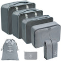 Gray travel organizer set with three mesh-top packing cubes, zippered cases, a drawstring bag, and a flat pouch.
