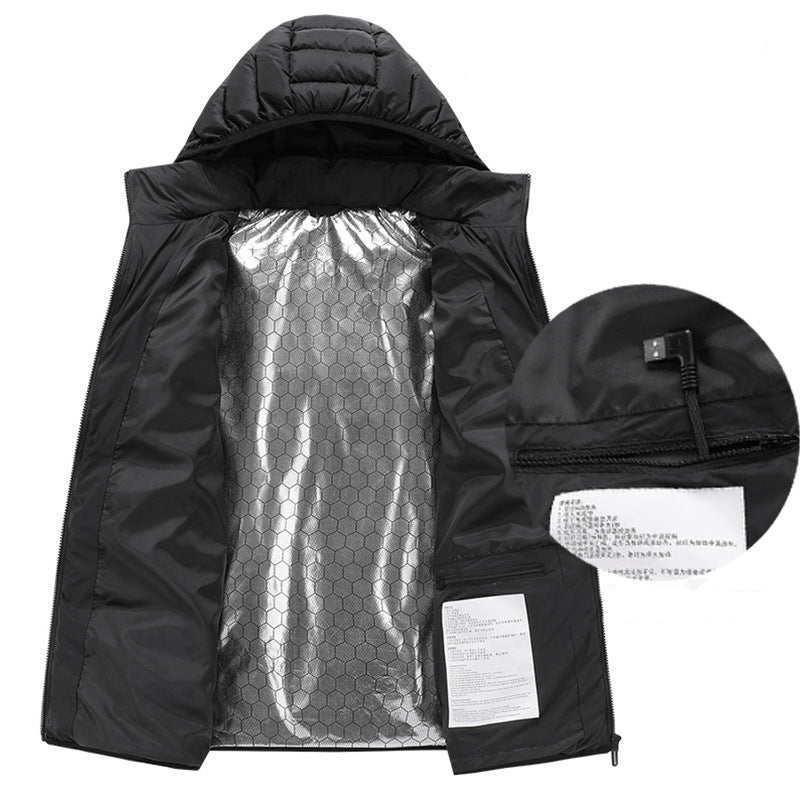 Black hooded jacket held open to show silver hexagon-pattern lining and an inset USB cable close-up.