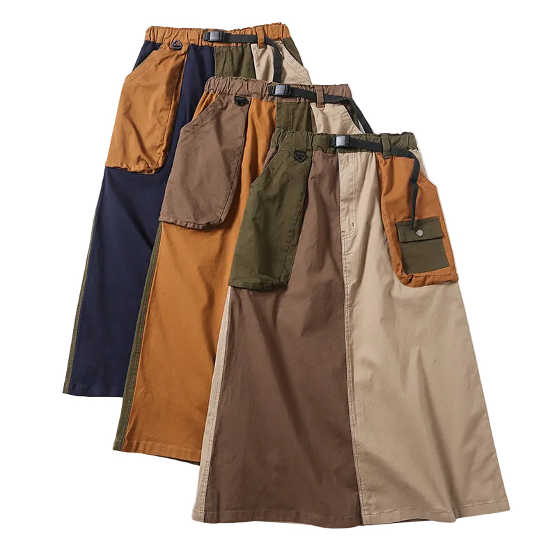 Three color-block cargo skirts with buckle belts and large patch pockets in navy, mustard, brown, beige, and olive.