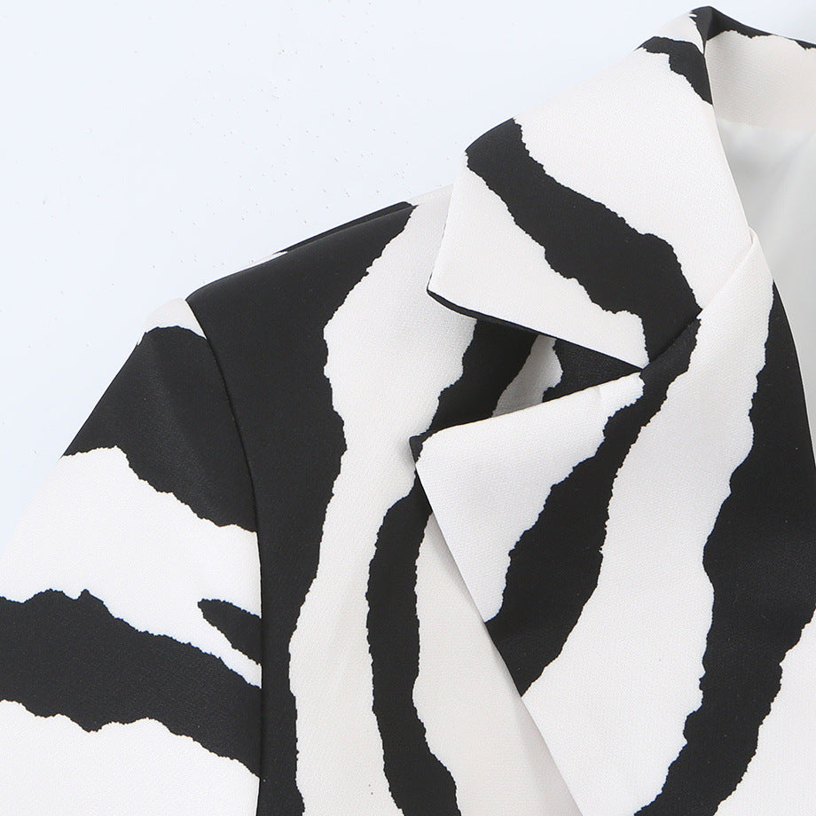 Close-up of the zebra-print jacket's shoulder and notched lapel.