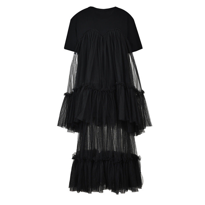 Black short-sleeve dress with a crewneck bodice, sheer mesh panels, and tiered ruffles, front view.