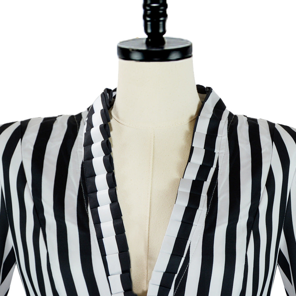 Close-up of the striped tailcoat's deep V-neck and ruffled lapel trim.