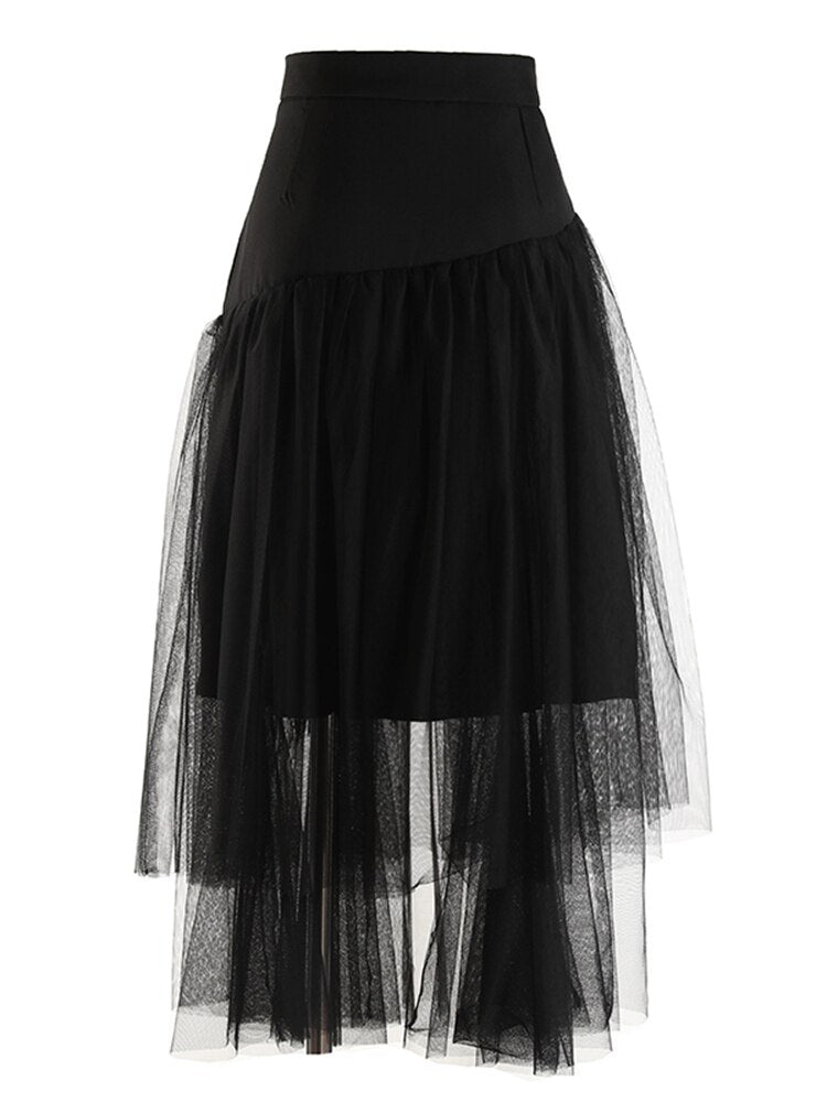 Back view of a black layered mesh skirt with an irregular sheer hem.
