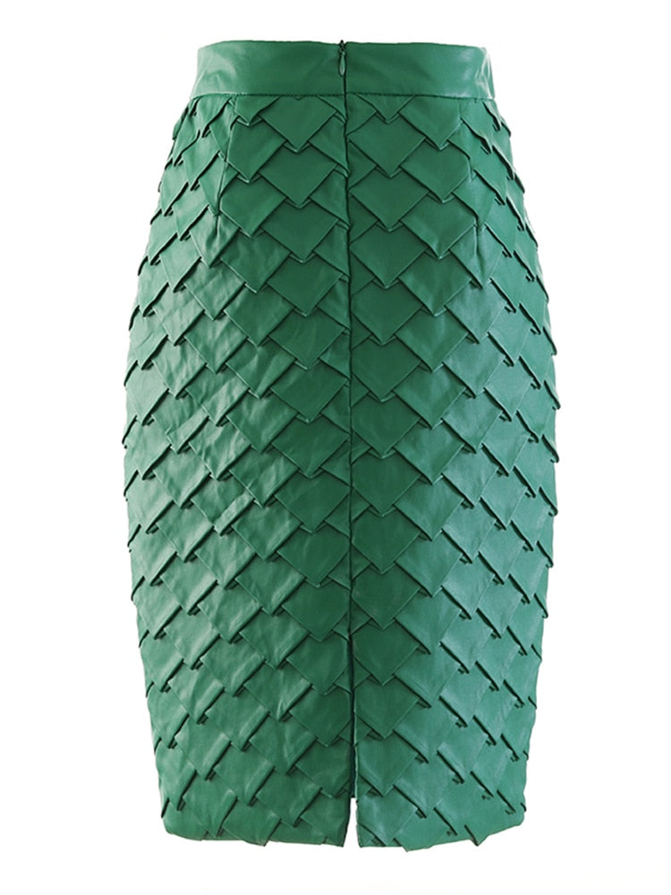 Back view of a green pencil skirt with overlapping diamond panels, a zipper, and a back slit.