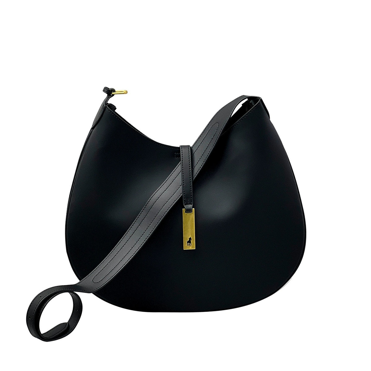 Black rounded shoulder bag with its long adjustable strap laid across the front and a gold-tone clasp.
