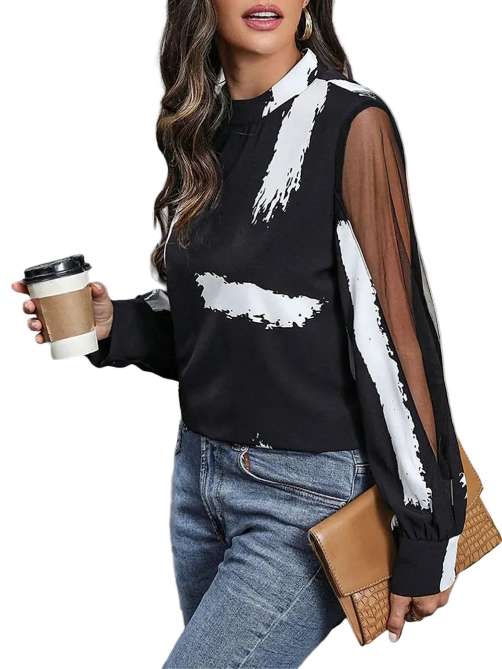 Angled view of a black and white brushstroke blouse showing a sheer sleeve panel and wide cuff.