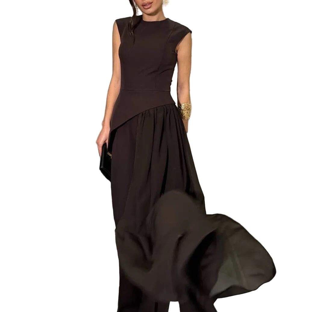 Model wearing a black sleeveless asymmetric top and wide-leg pants, with the sheer overlay lifted outward.