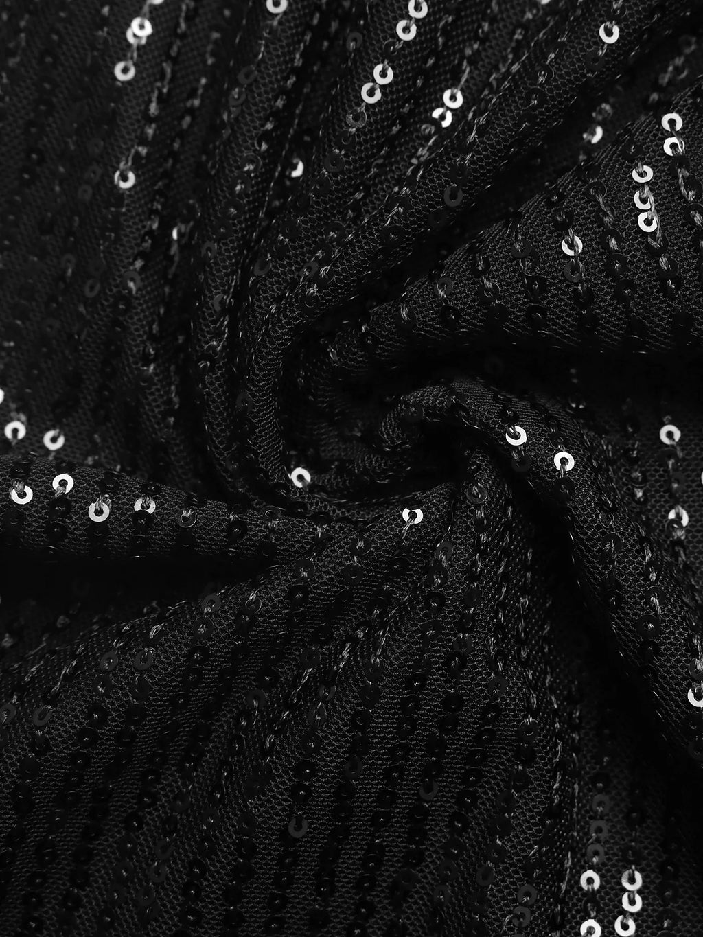 Close-up of black fabric with rows of small reflective sequins.