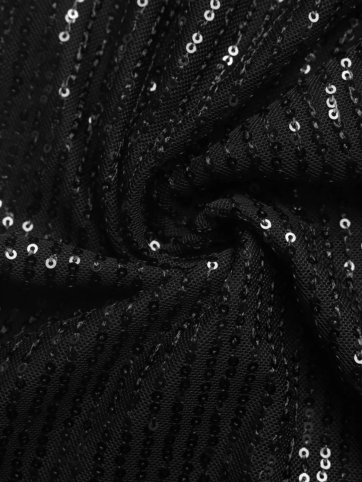 Close-up of black fabric with rows of small reflective sequins.