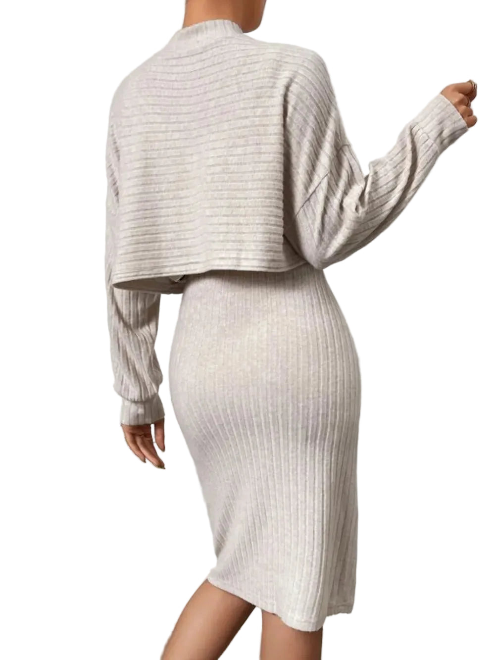 Back view of a cream cropped sweater worn over a matching ribbed knee-length dress.