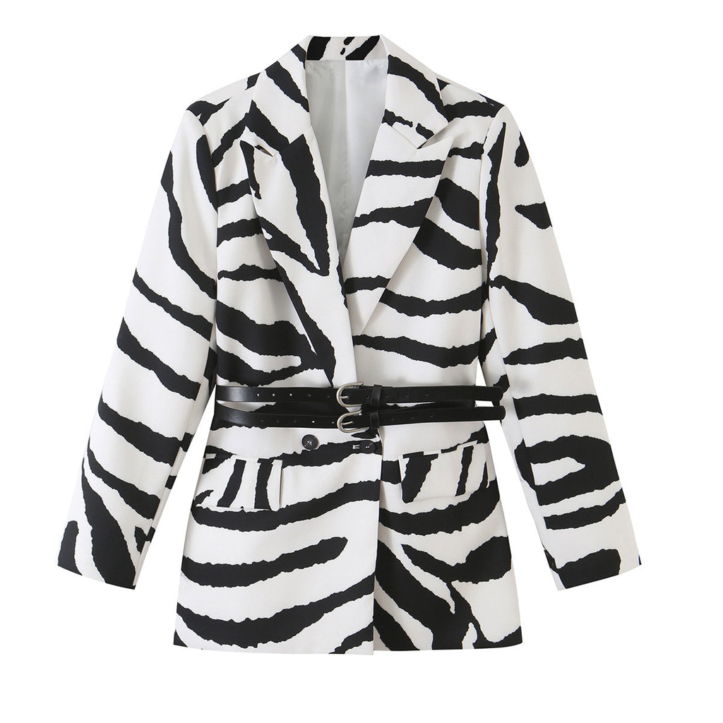 Black and white zebra-print blazer with notched lapels and two black buckle waist straps, front view.