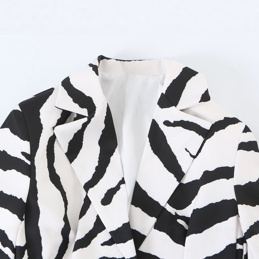 Close-up of the zebra-print jacket's wide notched lapels and white lining.