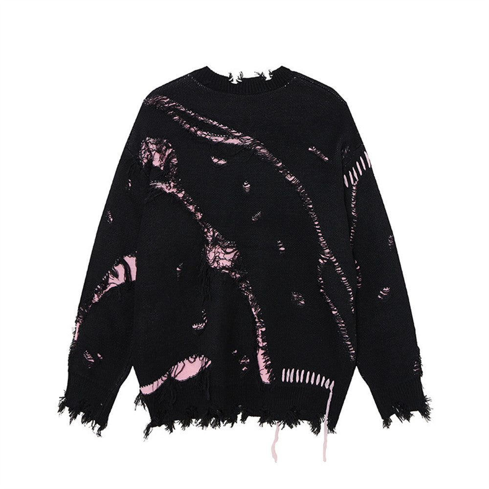 Back view of a black distressed sweater with pink accents and frayed cuffs and hem.