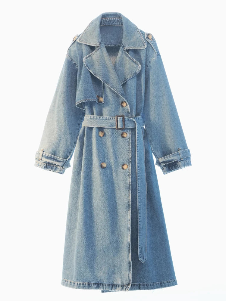 Light blue double-breasted denim trench coat with a buckle waist belt and cuff straps, front view.