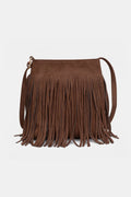 Brown rectangular shoulder bag with long fringe across the front and a slim strap, front view.
