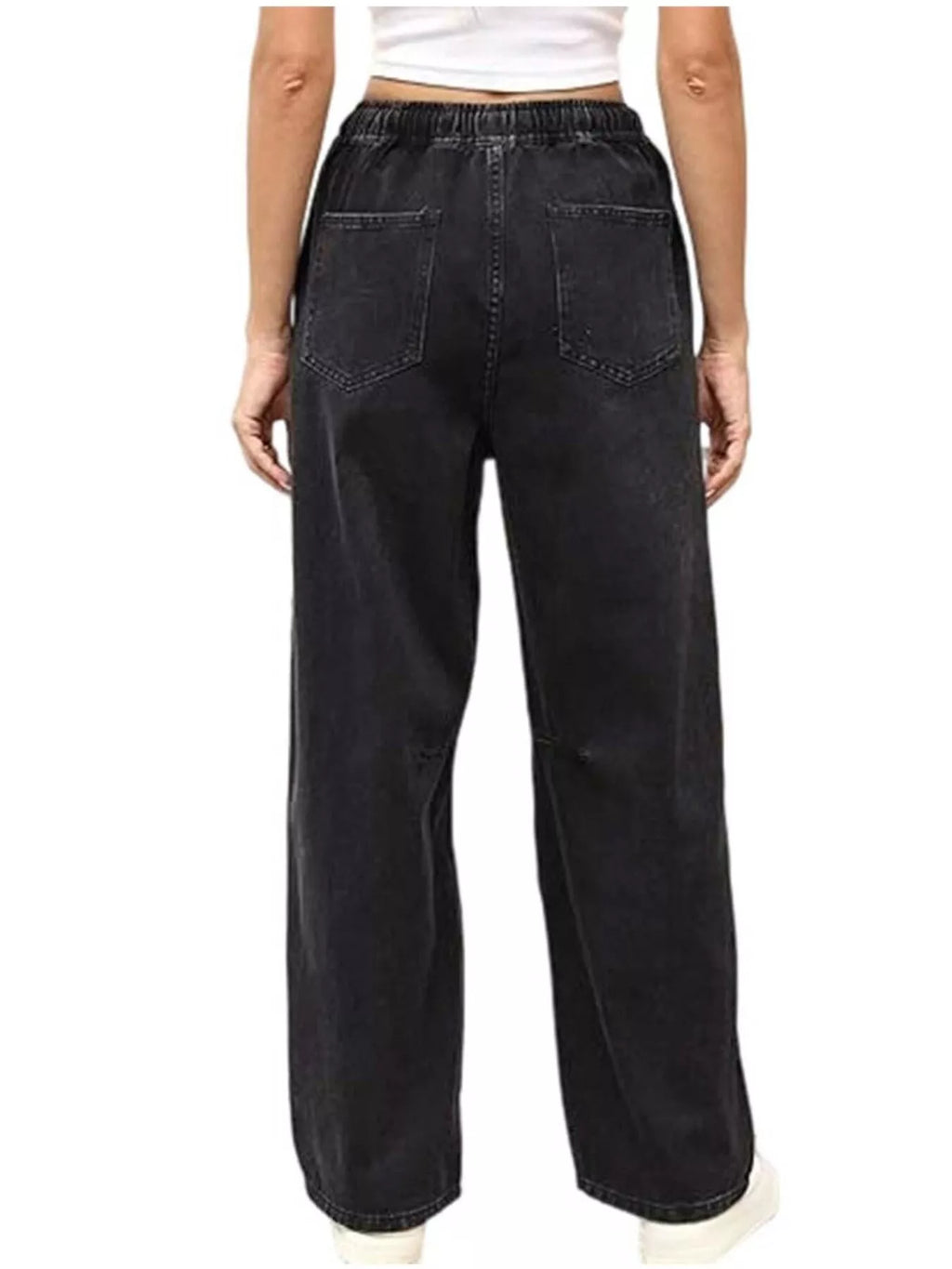 Back view of black wide-leg jeans with an elastic waist, rear patch pockets, and curved leg seams.