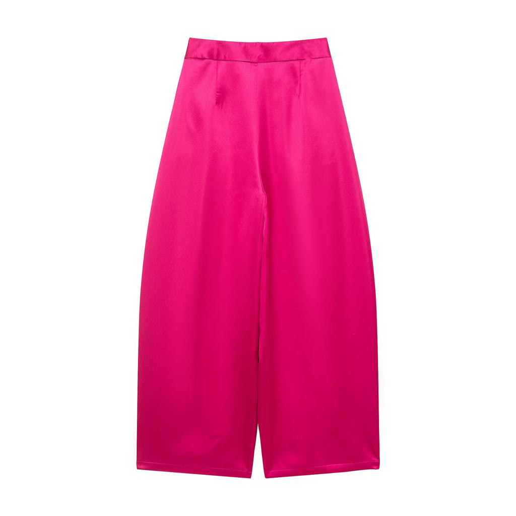 Back view of bright pink satin-look wide-leg pants.
