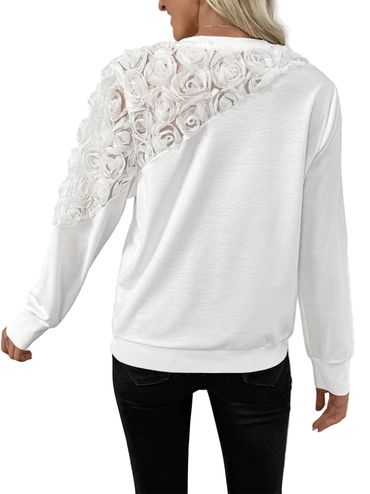 Back view of a white sweatshirt showing raised roses across one shoulder and upper sleeve.