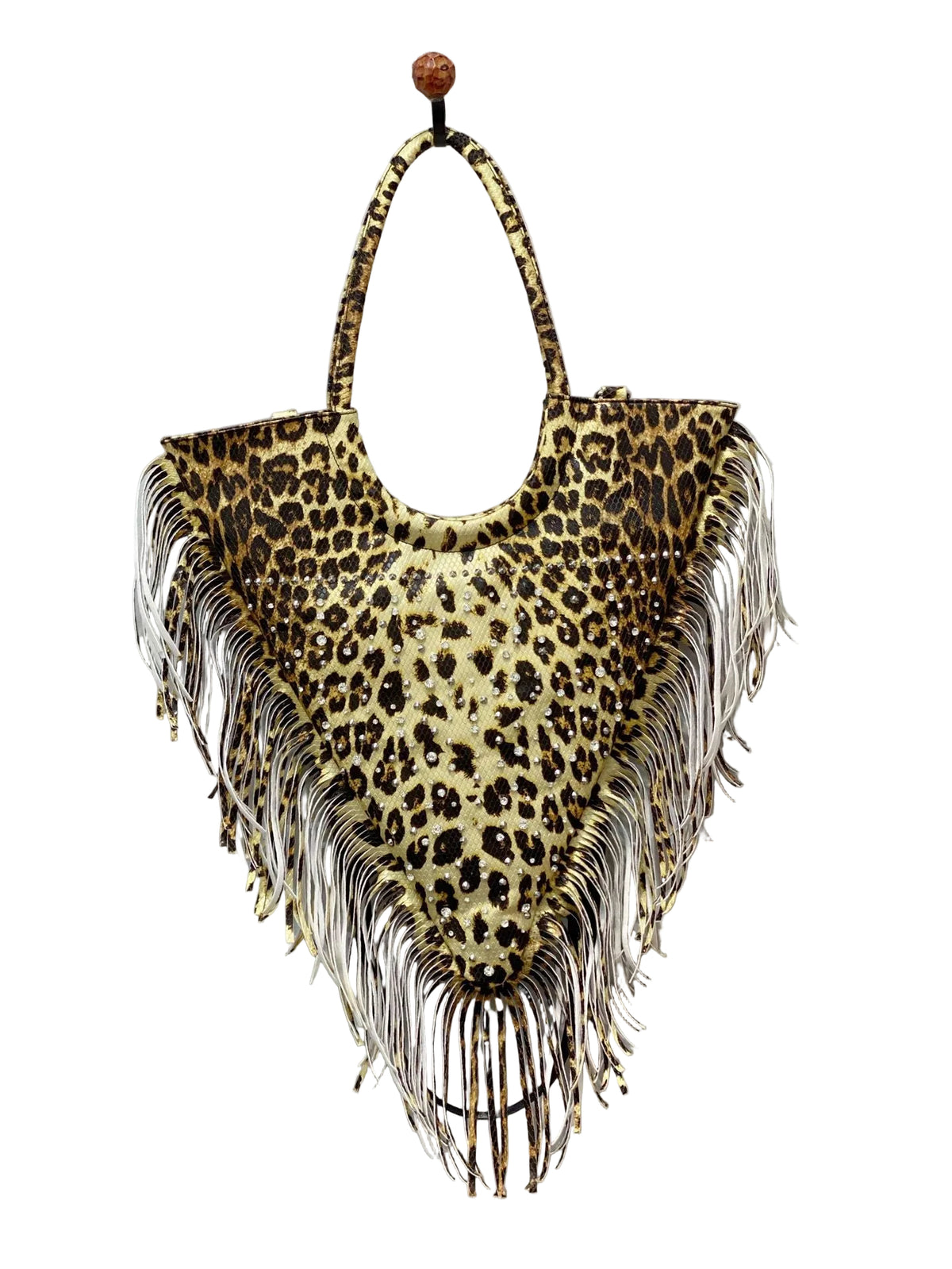 Leopard-print triangular tote with studs, long fringe, and loop handles, hanging front view.