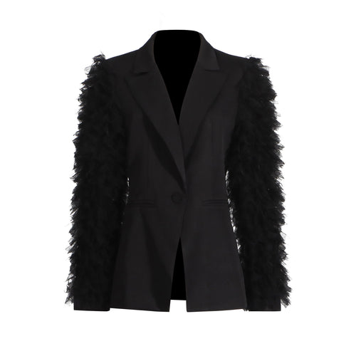 Black blazer with notched lapels and layered tulle ruffles down the sleeves, product view.