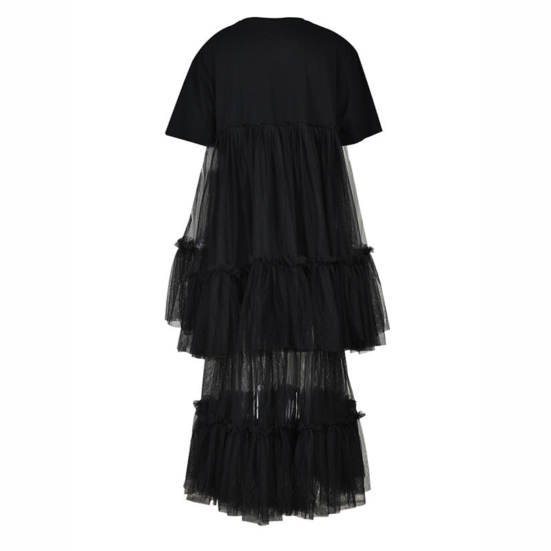 Back view of a black short-sleeve dress with sheer mesh panels and tiered ruffles.