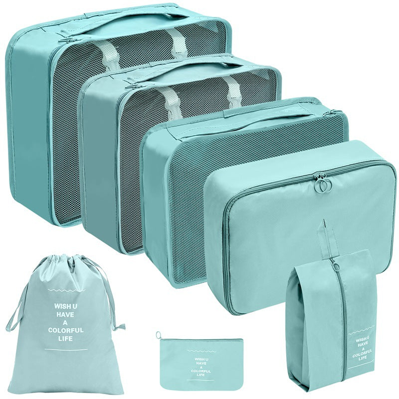 Mint travel organizer set with three mesh-top packing cubes, zippered cases, a drawstring bag, and a flat pouch.