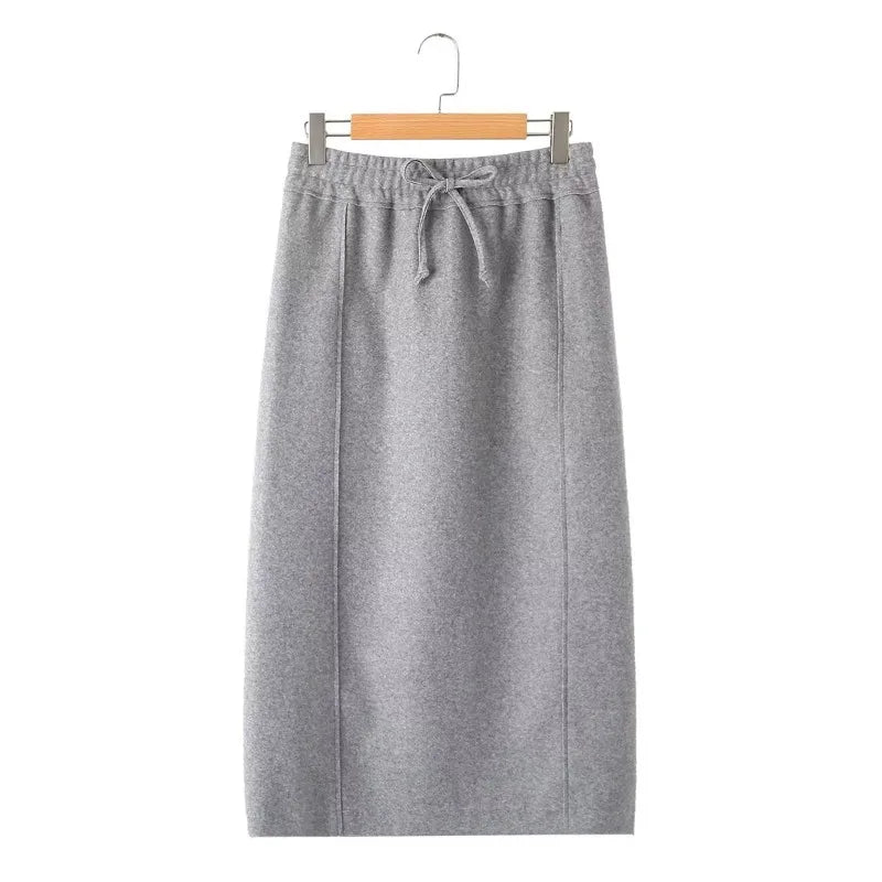Gray straight midi skirt with a drawstring elastic waist and vertical front seams, hanging front view.