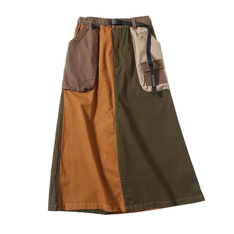 Mustard and olive color-block cargo skirt with brown and beige patch pockets and a buckle belt, front view.