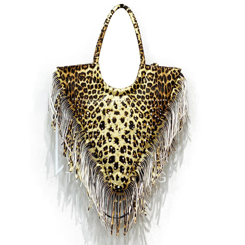 Triangular leopard-print tote with stud embellishments and long fringe along the sides and pointed base.