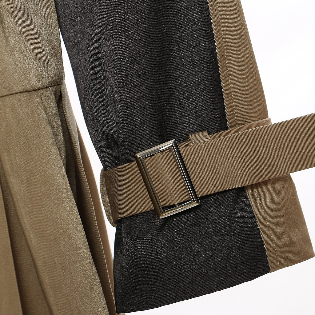 Close-up of the tan dress's black sleeve panel and tan buckle cuff strap.