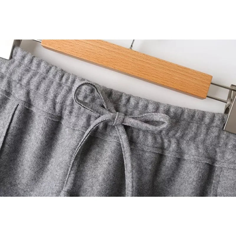 Close-up of the gray skirt's gathered elastic waistband and bow-tied drawstring.