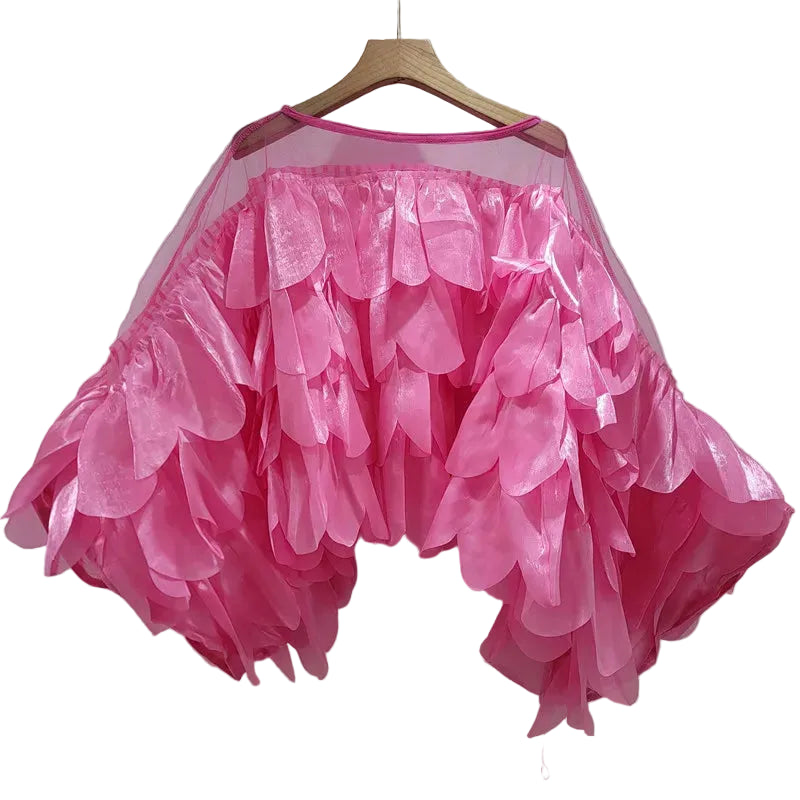Pink sheer blouse with layered petal details and wide bell sleeves, hanging front view.