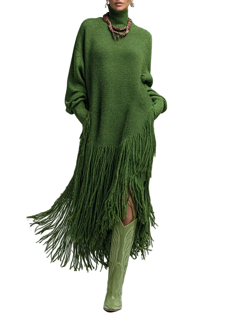 Model wearing a green turtleneck sweater dress with long sleeves and an asymmetric long fringe hem, front view.