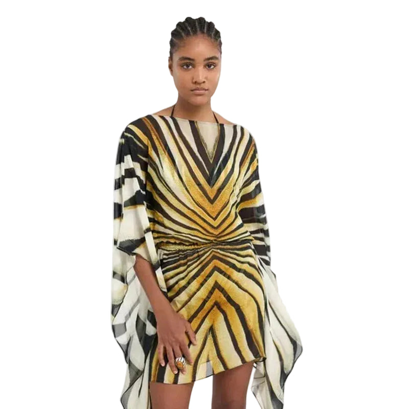 Front view of a black, cream, and gold striped draped tunic with gathered waist and wide sleeves.