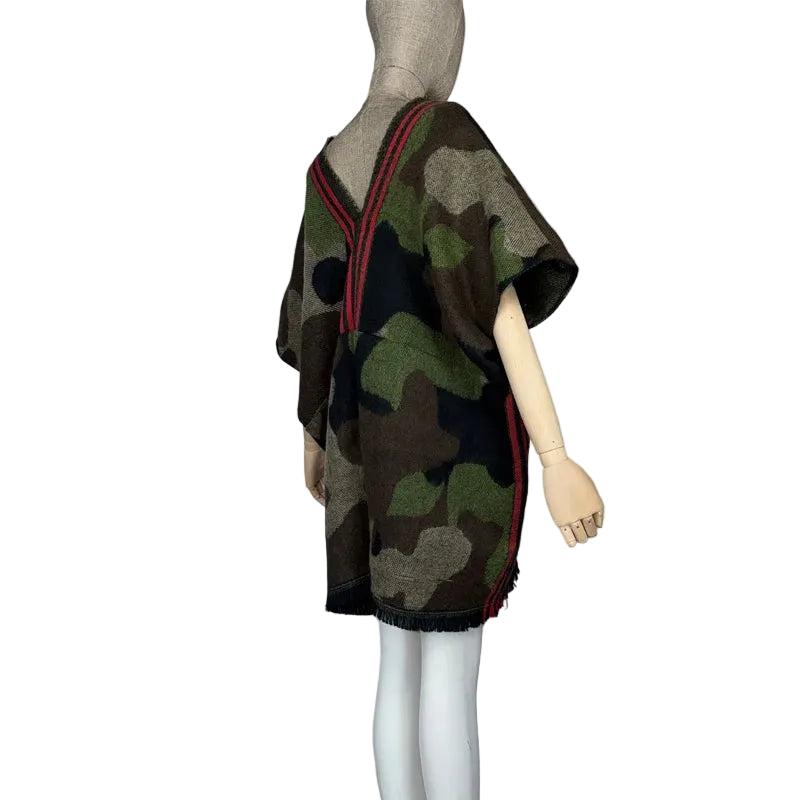 Side view of a camouflage tunic on a mannequin, showing the short sleeves and fringed hem.