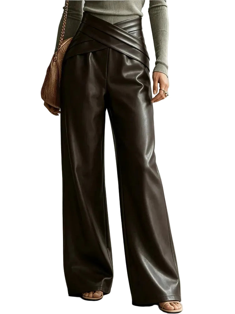 Model wearing shiny dark brown wide-leg pants with a crossed waistband, front view.