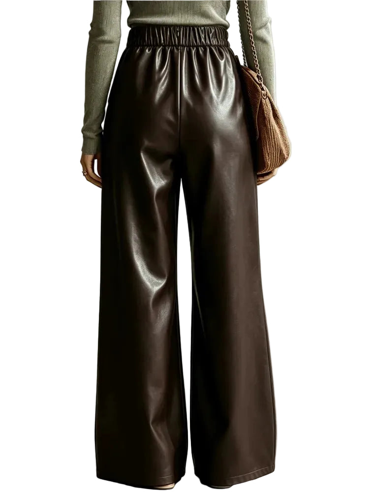 Back view of shiny dark brown wide-leg pants with a gathered elastic waistband.