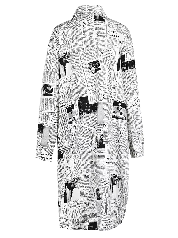 Back view of a white longline newspaper-print shirt with long sleeves and a curved hem.