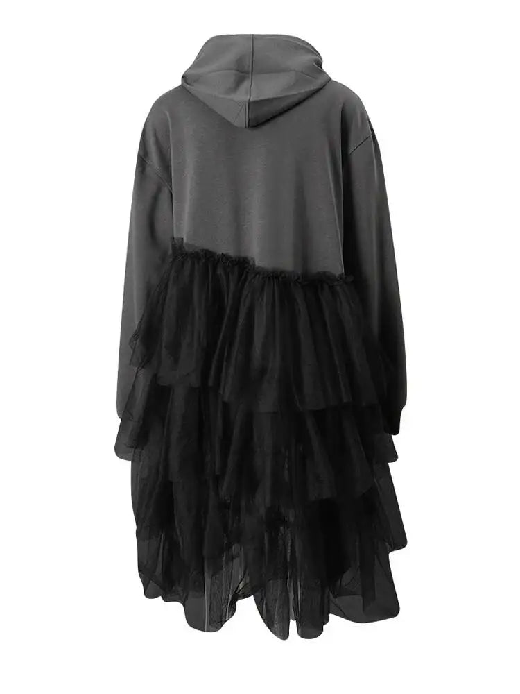 Back view of a gray hooded dress with a black tiered tulle skirt and long sleeves.