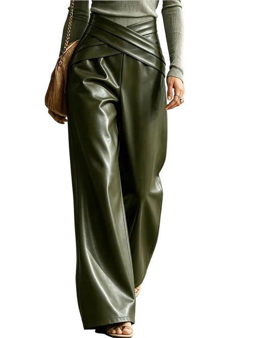 Model wearing shiny olive green wide-leg pants with a crossed waistband, front view.