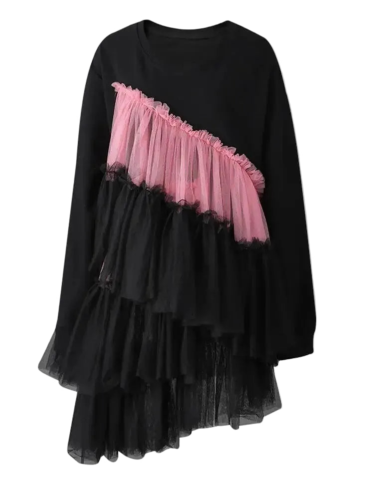 Black crewneck dress with long sleeves and diagonal pink and black tiered tulle ruffles, product view.