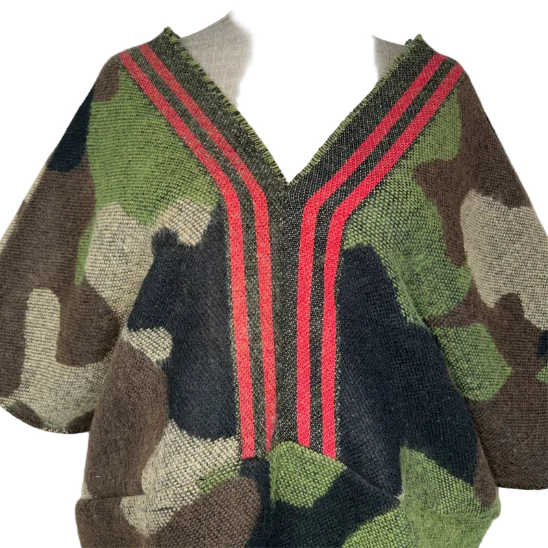 Close-up of the camouflage tunic's red-striped V-neckline and textured fabric.