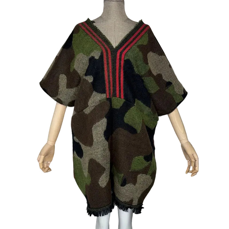Camouflage V-neck tunic with red neckline stripes, short batwing sleeves, and a fringed hem on a mannequin.