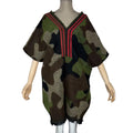 Camouflage V-neck tunic with red neckline stripes, short batwing sleeves, and a fringed hem on a mannequin.