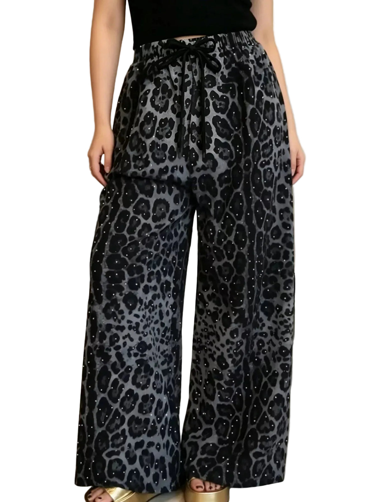 Model wearing gray and black leopard-print wide-leg pants with a drawstring waist and sparkling dots, front view.