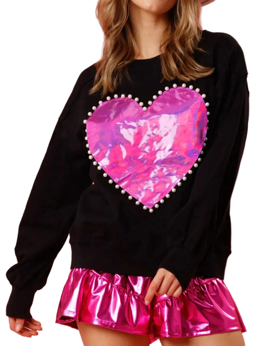 Model wearing a black long-sleeve sweatshirt with a pink metallic heart edged in pearl-like beads, front view.