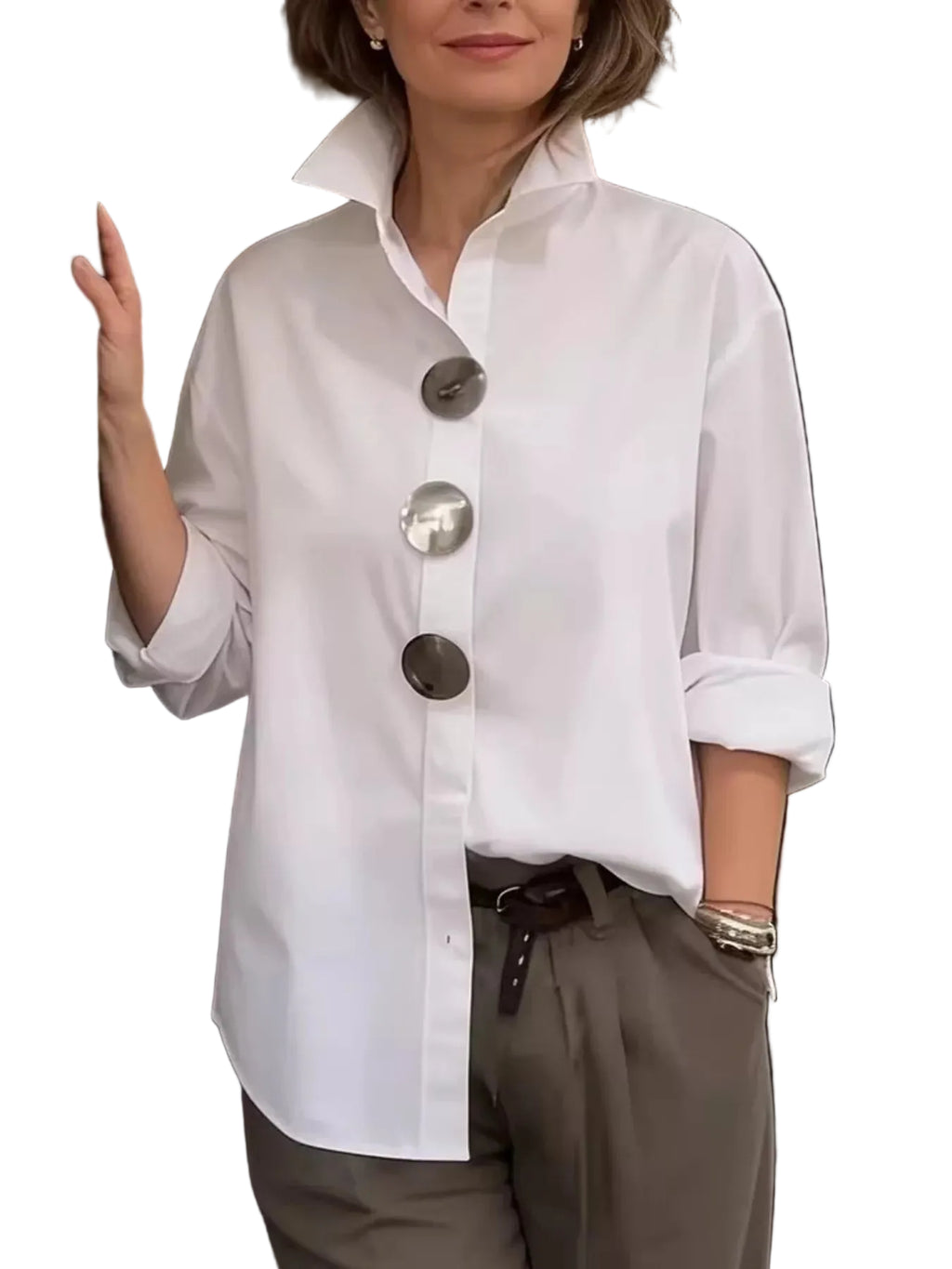 Model wearing a white collared shirt with oversized metal buttons and rolled sleeves, front view.