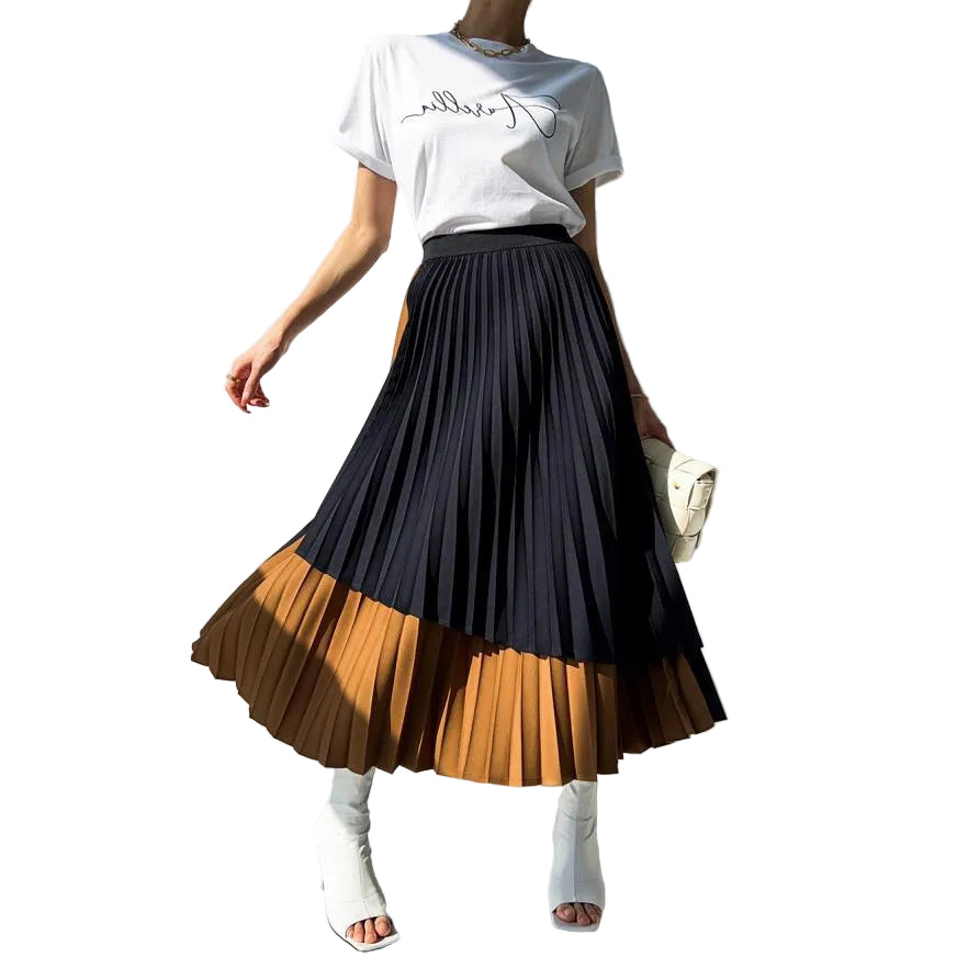 Model wearing a black and caramel pleated midi skirt with an asymmetric layered hem, front view.