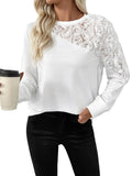 Model wearing a white sweatshirt with raised roses on one shoulder and sleeve, holding a coffee cup.